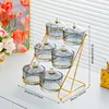 6 glass discs, smoky gray staircase pattern, gold support