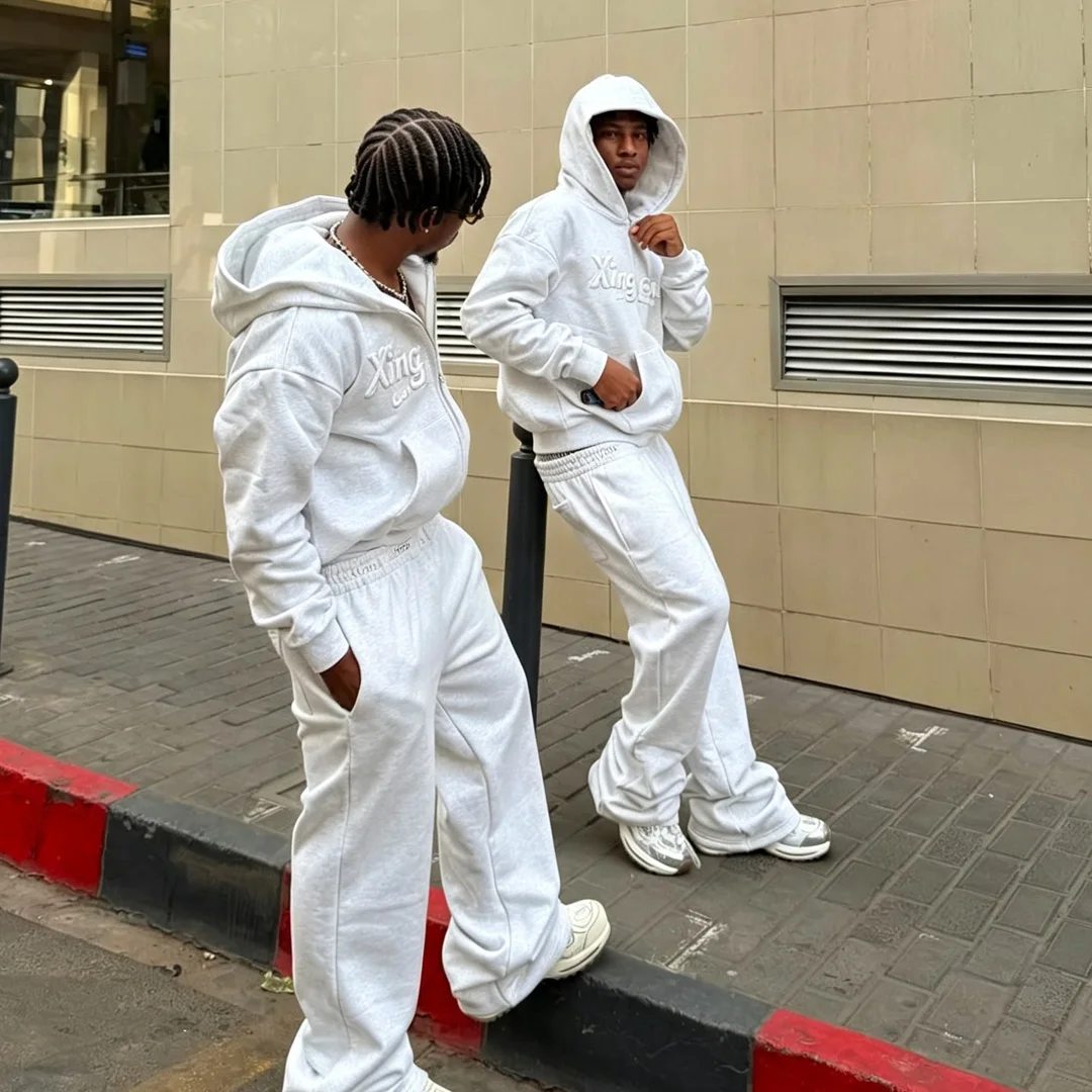 Brugerdefineret unisex streetwear-tracksuit i heathergrå farve, 3D puff-print, løst og bredt fladende 2-delset, OEM tilgængelig til større ordrer