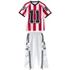 Red striped top + white overalls trousers