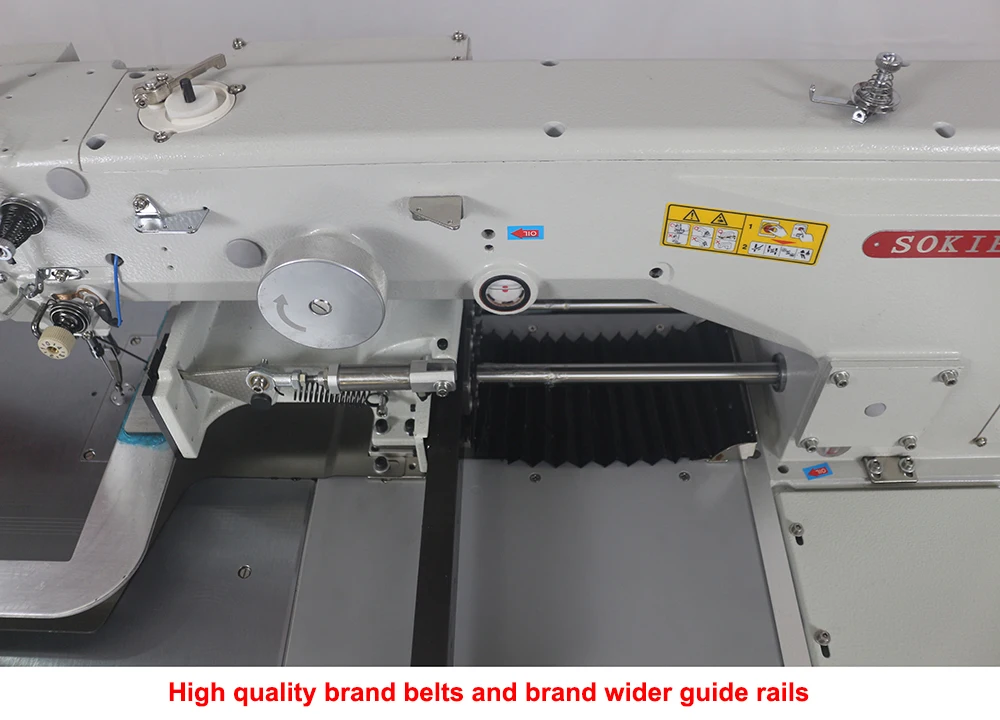 Programmable Sewing Machine Sews Small Square Tags Onto Nylon bing