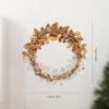 Corona de flores doradas 11cm
