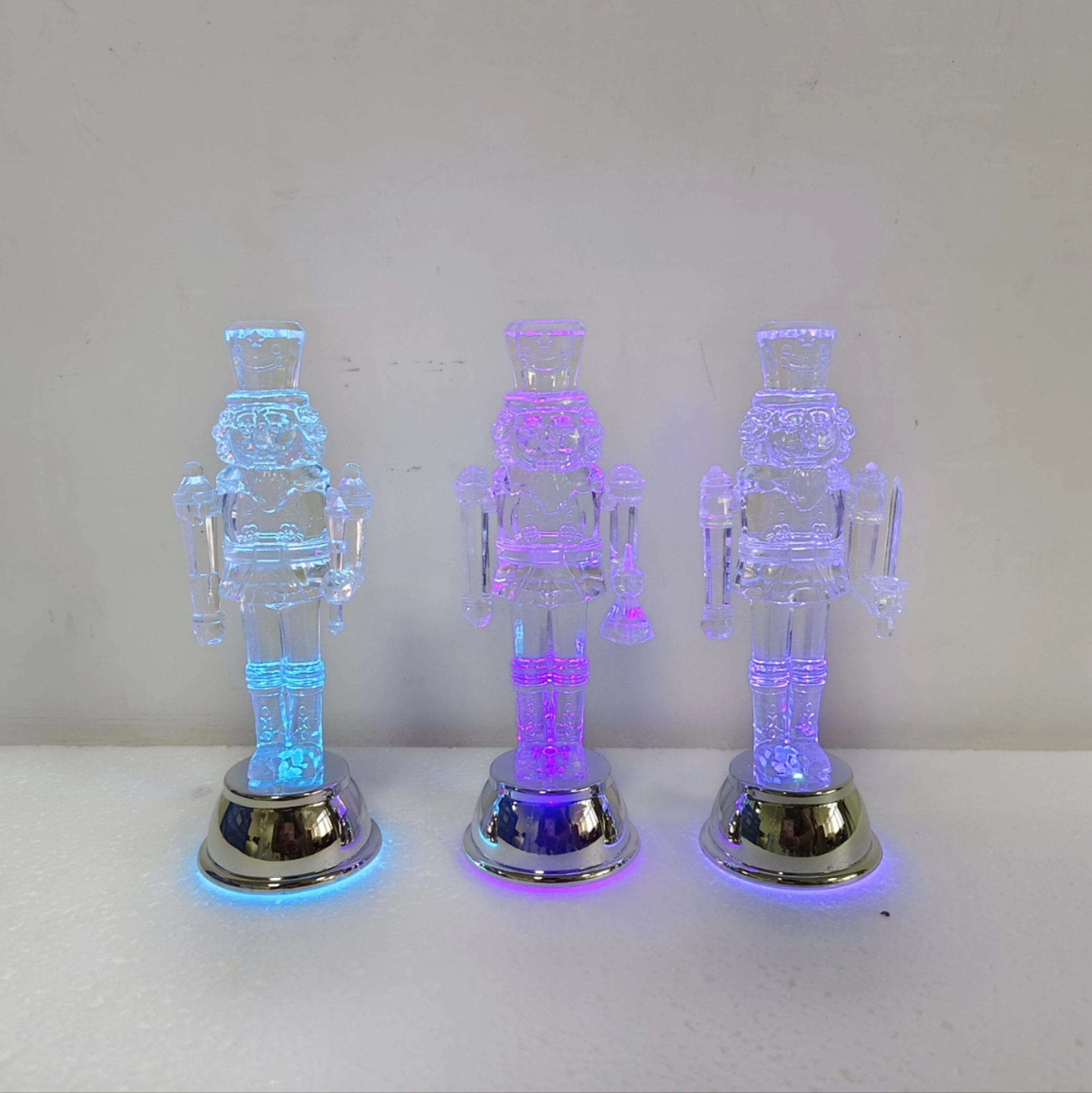 6.1" Led Lighted Transparent Acrylic Nutcracker With Electriced Gold Sliver Base