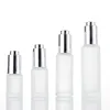 Frosted bottle with silver tops