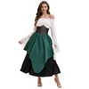 White top with a cinched waist and green midi skirt