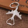 ouvre-bouteille en argent - forme d'avion