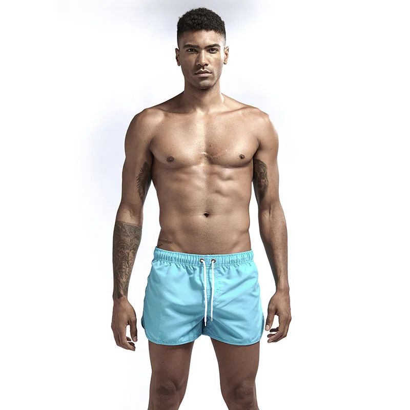 Men's Solid four-point Beach Swimming Pants Fashion Multi color Polyester Board Shorts Straight Loose Sports Shorts855_voghion.com