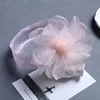 Fuzz ball con bordo cangiante, motivo floreale, arancione