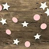 Cercle rose coloré avec un pentagramme blanc.