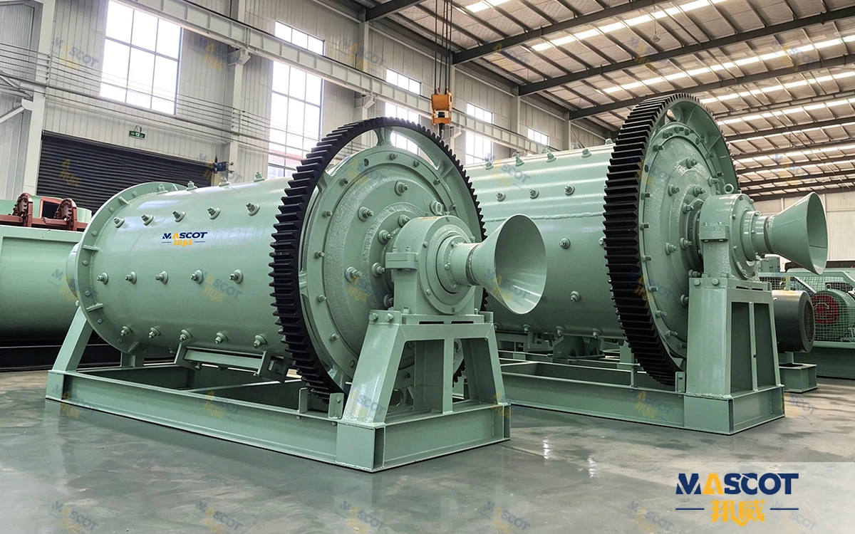 Cement ball mill grinding raw mix for kiln feed, showing the two-chamber charge and the dynamic separator that closes the circuit