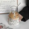 Simple letter cup with black letters and straw
