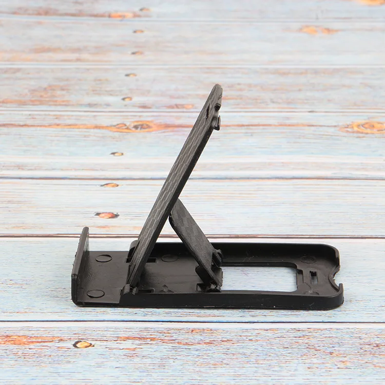 Foldable universal adjustable mobile phone holder