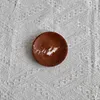Diámetro 10, altura 2 cm, mármol rojo coral.