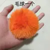 Palla di peluche color cachi [arancione]