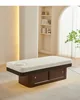 Cama recta color nogal con luz ambiental y almohada para abrazar.