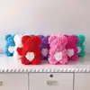 thin rosy bear with white heart with box