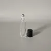 Clear bottle + steel ball + black plastic cap