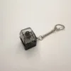Clé unique coque noire-capuchon transparent noir-axe noir clair à