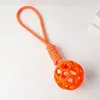 Orange hollow ball with rope, approximately 97g, 40cm