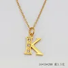(Gold) letter K (including chain)