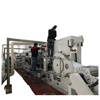 Highly cost effective automatic folding sanitary napkin pad making machine