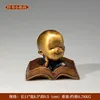 Little Monk with Buddhist Scriptures