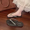 Black beaded flip-flops