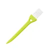 Green Handle With White Hairbrush