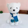 Oso con bufanda azul y blanca.