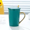 Glossy dark green with porcelain lid and gold spoon