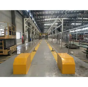 Final assembly line bus floor chain conveyor system for manufacturing plant