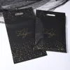 Bolso tote negro con estampado de estrellas