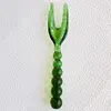 Green glass bead fork