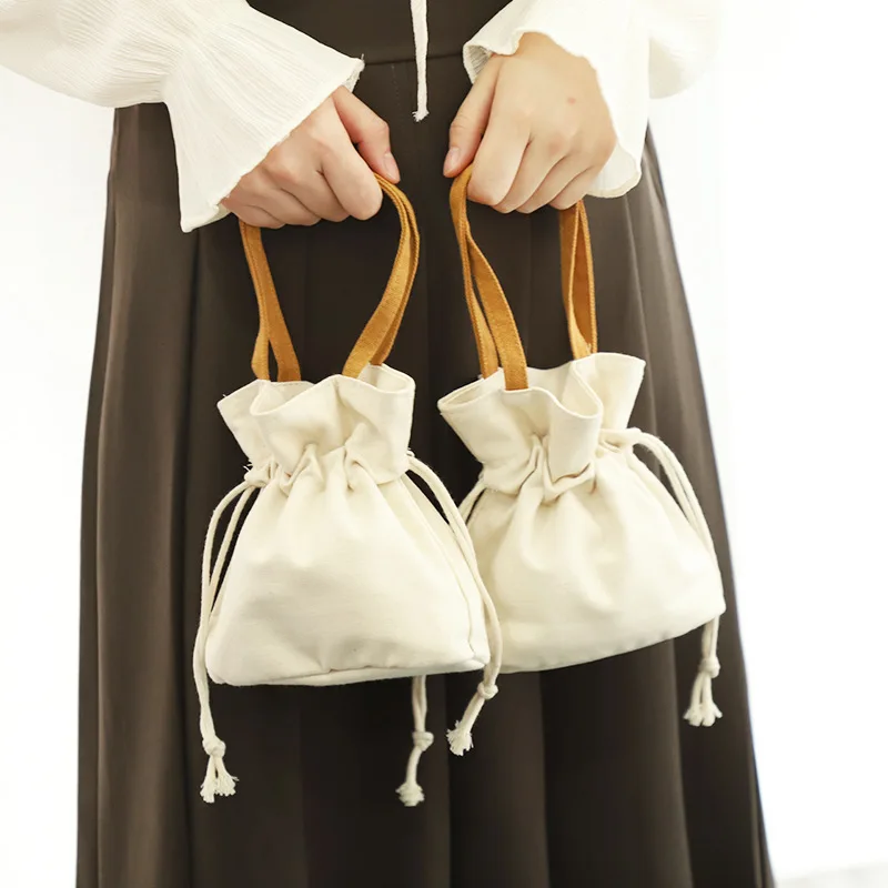 Solid Color Artistic Canvas Tote Bag with Simple Drawstring Design Mini Mobile Phone Key Storage Fashionable Letter Pattern