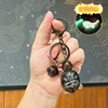 Portachiavi luminoso a forma di piccola tartaruga - uccellino nero