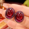 Black Gold red corundum stud earrings