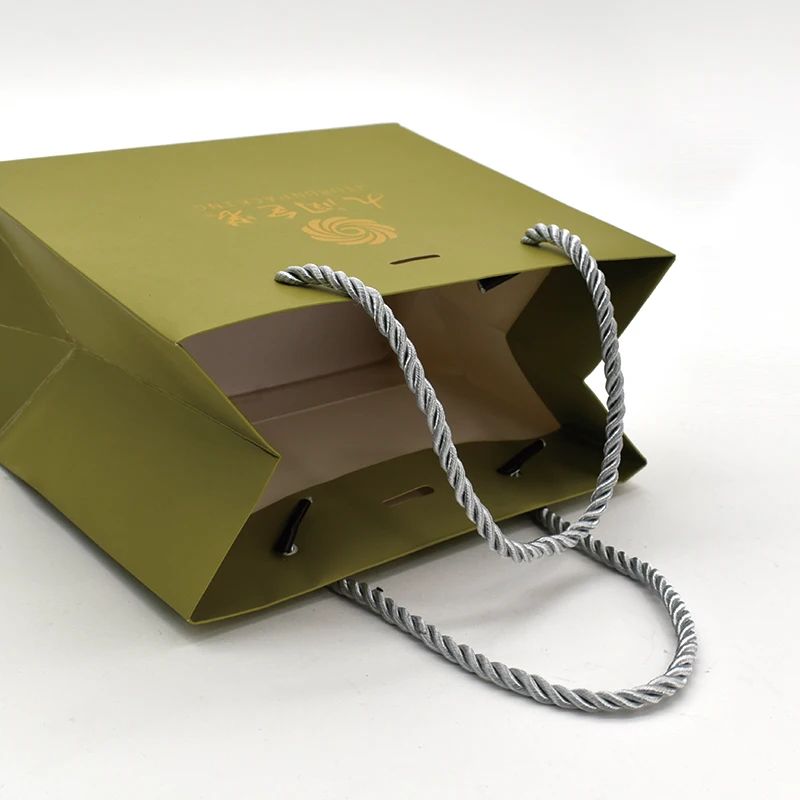 Customized Luxury Premium Gift Bag with Exquisite Embossing Sponge Lining UV Coating Matt Lamination details