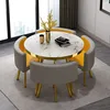 Mesa blanca + silla gris/naranja/dorada