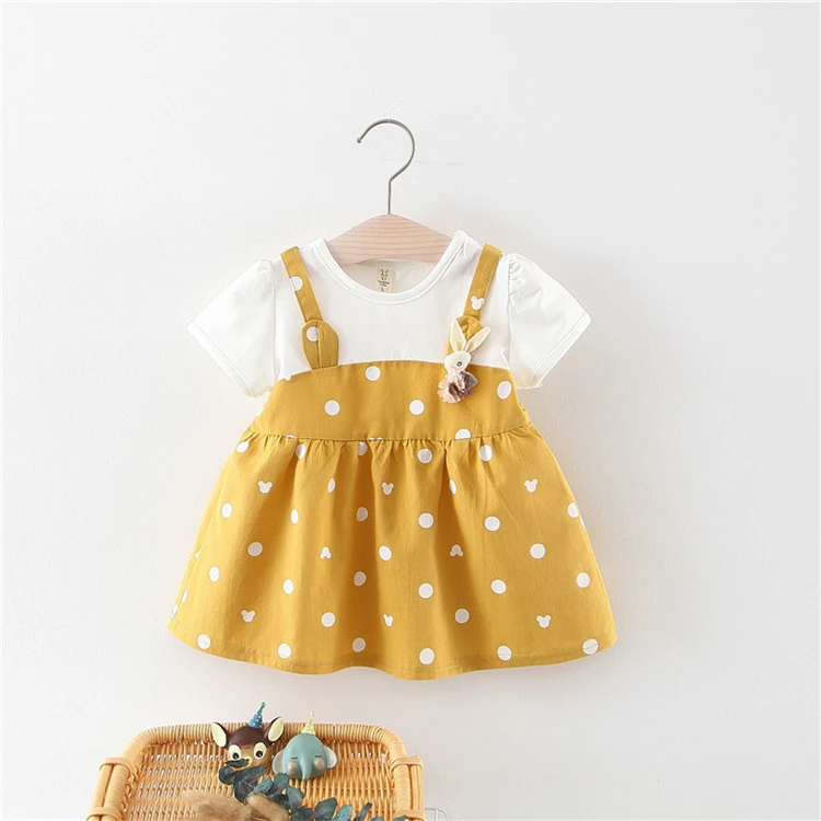 cute baby girl in yellow dress