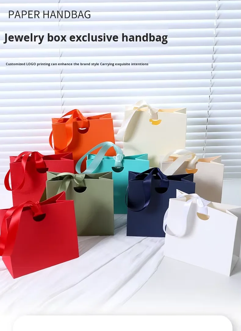 Solid color jewelry gift bags with ribbon displayed in various elegant shades