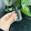 Botella transparente con tapa negra