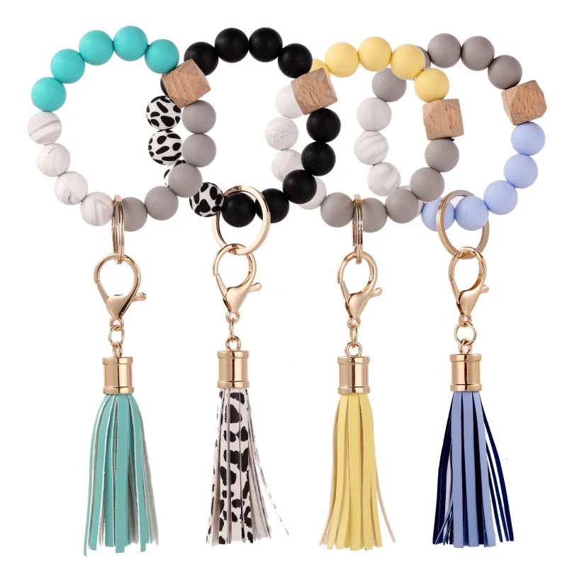 Wholesale Custom Luxury Tassel Puff Keychain With Small Bag Bracelet Girls  Wristlet PU Leather Bangle Keychains Gift Set for Woman From m.