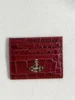 Red alligator-patterned card holder