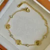 Bracciale circolare H in oro