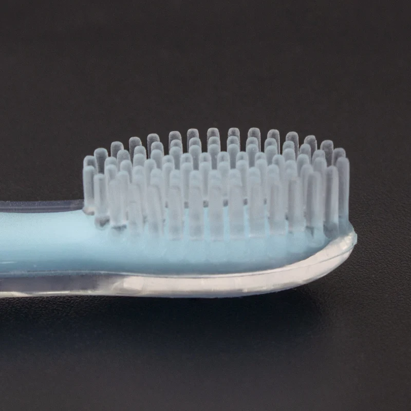 OEM цветной защитный блок, предотвращающий проглатывание, синяя ручка, стоячая всасывающая детская силиконовая зубная щетка