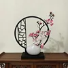 Vertical screen white teapot with pink plum blossoms