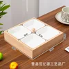 Four-compartment lid with four white melamine dishes