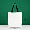 Bolso tote negro de 21*23 con asa de lona blanca.
