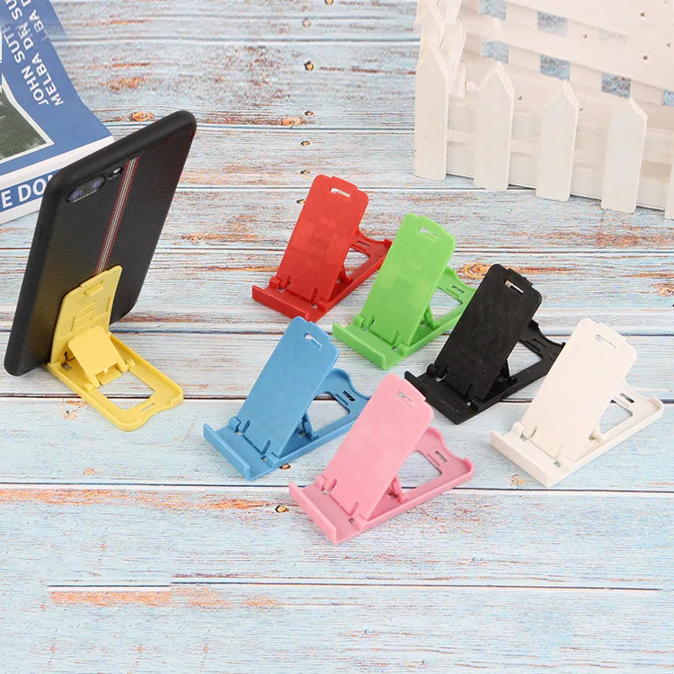 Foldable universal adjustable mobile phone holder