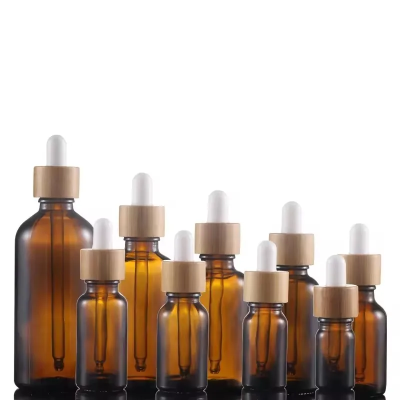 Amber packaging essential oil OEM /ODM glass packaging container bamboo cap Dropper bottle manufacturer