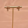 GE0810-9 Orecchini a bottone floreali